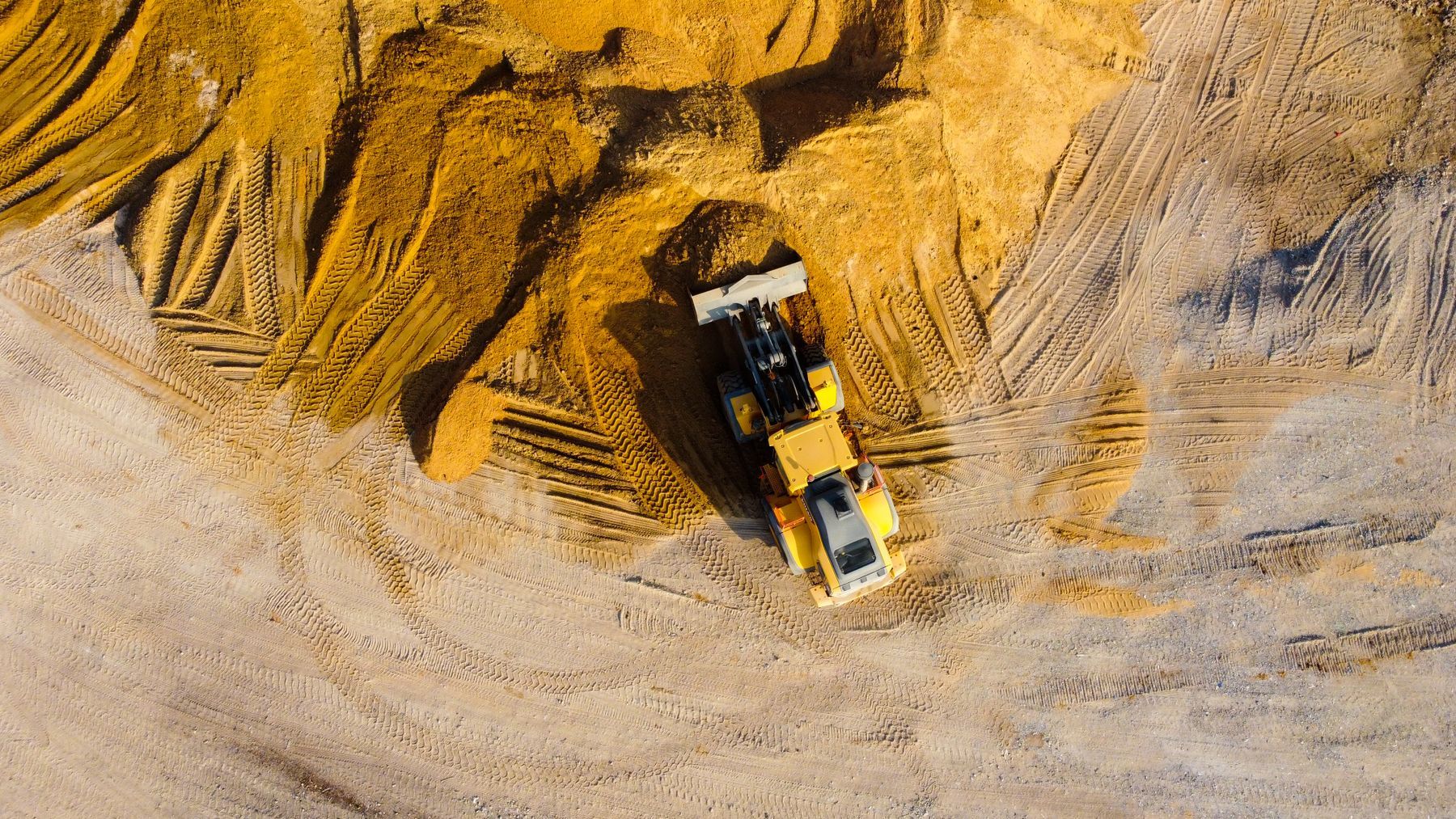 Dozer working a cleared site from above